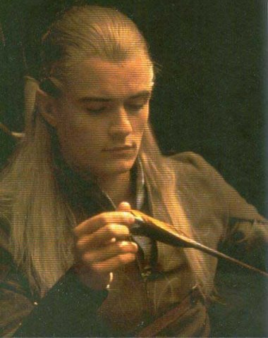 inspecting his arrow fletching